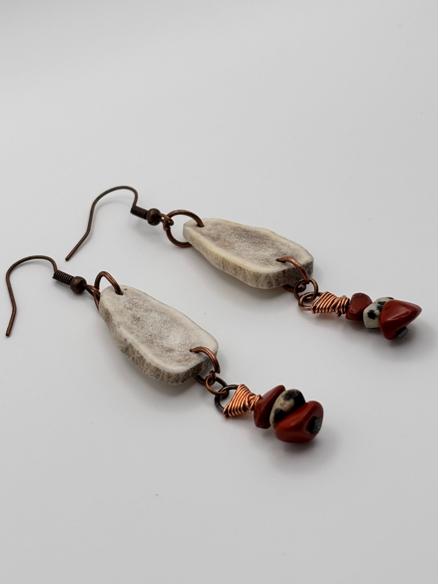 Natural antler and jasper earrings flat lay