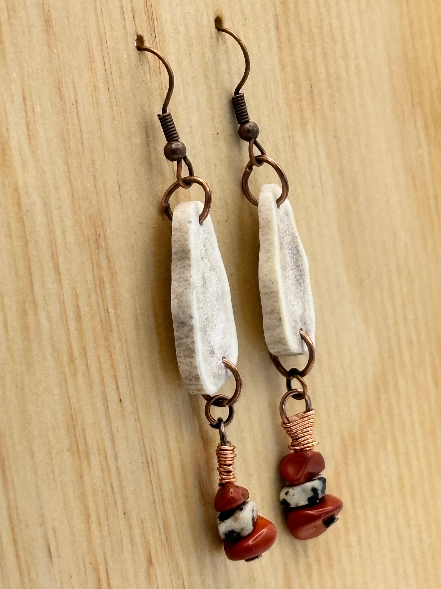 Rustic antler and red stone dangle earrings close-up