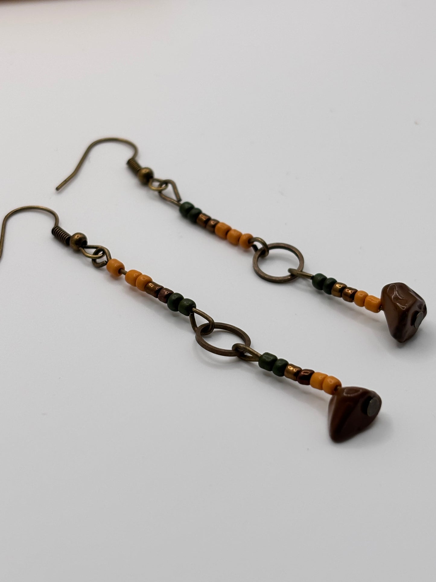 Pair of beaded earrings on a white background