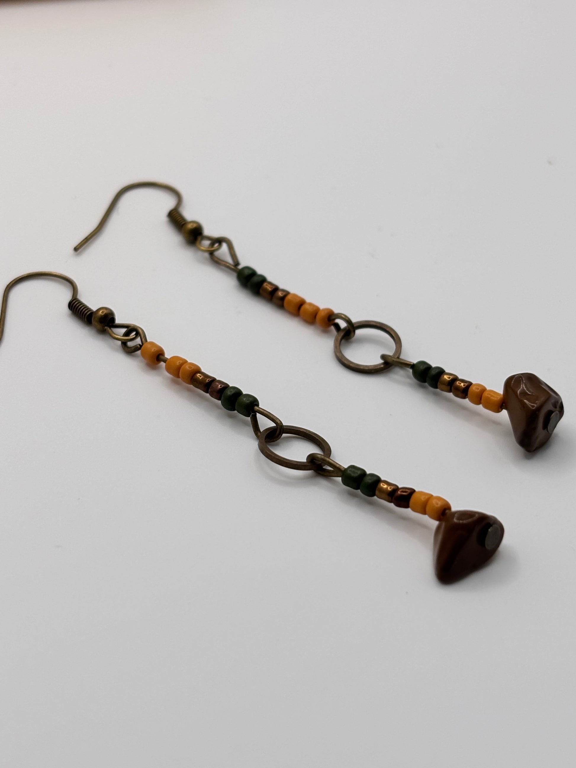 Pair of beaded earrings on a white background
